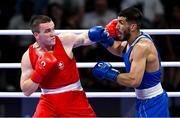 1 August 2024; Jack Marley of Team Ireland, left, in action against Davlat Boltaev of Team Tajikistan during their men's 92kg quarter-finals at the North Paris Arena during the 2024 Paris Summer Olympic Games in Paris, France. Photo by Brendan Moran/Sportsfile
