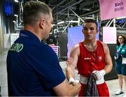 1 August 2024; Jack Marley of Team Ireland with Minister of State for Sport and Physical Education Thomas Byrne after his defeat against Davlat Boltaev of Team Tajikistan during their men's 92kg quarter-finals at the North Paris Arena during the 2024 Paris Summer Olympic Games in Paris, France. Photo by David Fitzgerald/Sportsfile