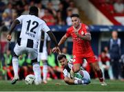 1 August 2024; John O'Sullivan of Shelbourne in action against Ifeanyi Onyedika, left, and Bledian Krasniqi of FC Zurich during the UEFA Conference League second qualifying round second leg match between Shelbourne and FC Zurich at Tolka Park in Dublin. Photo by Thomas Flinkow/Sportsfile