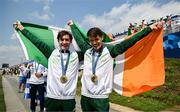 2 August 2024; Paul O'Donovan, left, and Fintan McCarthy of Team Ireland celebrate with their gold medals after winning the men's lightweight double sculls A final at Vaires-sur-Marne Nautical Stadium during the 2024 Paris Summer Olympic Games in Paris, France. Photo by Brendan Moran/Sportsfile