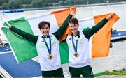 2 August 2024; Paul O'Donovan, left, and Fintan McCarthy of Team Ireland celebrate with their gold medals after winning the men's lightweight double sculls A final at Vaires-sur-Marne Nautical Stadium during the 2024 Paris Summer Olympic Games in Paris, France. Photo by David Fitzgerald/Sportsfile