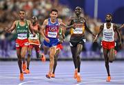 2 August 2024; Joshua Cheptegei of Team Uganda, centre, crosses the line to win gold in the men's 10,000m final setting a new Olympic record of 26:43.14 at the Stade de France during the 2024 Paris Summer Olympic Games in Paris, France. Photo by Sam Barnes/Sportsfile