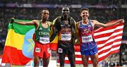 2 August 2024; Men's 10,000m medallists, from left, silver medallist Berihu Aregawi of Team Ethiopia, gold medallist Joshua Cheptegei of Team Uganda, and bronze medallist Grant Fisher of Team USA at the Stade de France during the 2024 Paris Summer Olympic Games in Paris, France. Photo by Sam Barnes/Sportsfile