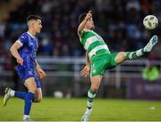 2 August 2024; Aaron Greene of Shamrock Rovers in action against Darragh Leahy of Waterford during the SSE Airtricity Men's Premier Division match between Waterford and Shamrock Rovers at the Regional Sports Centre in Waterford. Photo by Michael P Ryan/Sportsfile