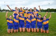 3 August 2024; Carrigaline, Cork, captain Rachel O'Regan lifts the Junior Shield alongside her teammates at the O’Neills All-Ireland Club 7s competitions at Naomh Mearnóg and St Sylvester’s GAA clubs in Dublin.  Photo by Ben McShane/Sportsfile