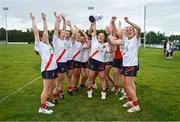 3 August 2024; Milltown, Kildare, captain Lisa Byrne lifts the Junior Championship cup alongside her teammates at the O’Neills All-Ireland Club 7s competitions at Naomh Mearnóg and St Sylvester’s GAA clubs in Dublin.  Photo by Ben McShane/Sportsfile