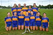 3 August 2024; Carrigaline, Cork, players with the Junior Shield at the O’Neills All-Ireland Club 7s competitions at Naomh Mearnóg and St Sylvester’s GAA clubs in Dublin.  Photo by Ben McShane/Sportsfile