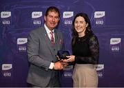 4 August 2024; Player of the Match in the 2019 TGA All-Ireland senior final, which had a record attendance of 56,114, Lyndsey Davey of Dublin is presented with a commemorative medallion by LGFA president Mícheál Naughton at a special lunch to celebrate key milestones in 50 years of the LGFA ahead of the 2024 TG4 All-Ireland Finals at Croke Park in Dublin. Photo by Seb Daly/Sportsfile