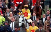 18 March 1998; Brian Harding celebrates on One Man as they arrive back to parade ring after winning the Queen Mother Champion Chase during day two of the Cheltenham Racing Festival at Prestbury Park in Cheltenham, England. Photo by Matt Browne/Sportsfile