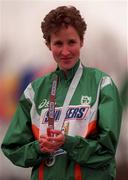 25 March 1995; Catherina McKiernan with her silver medal following the IAAF World Cross Country Championships at the University of Durham in Durham, England. Photo by Brendan Moran/Sportsfile