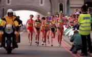 26 April 1998; Catherina McKiernan of Ireland, second from right, crossing Tower Bridge during the London Marathon in London, England. Photo by Brendan Moran/Sportsfile