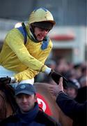 9 January 1999; Jockey David Evans is congratuled as he enters the parade ring on Archive Footage after they won the 13th Ladbroke Hurdle during Horse Racing from Leopardstown Racecourse in Dublin. Photo by Aoife Rice/Sportsfile