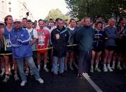 26 October 1998; Athletes observe a minute's silence in remembrance of Noel Carroll prior to the 98FM Dublin City Marathon in Dublin. Photo by Brendan Moran/Sportsfile
