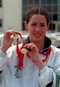 20 July 1998; Emily Maher with her 2 gold medals she won at the World Youth Olympics in Moscow during her homecoming at Dublin Airport. Photo by Gerry Barton/Sportsfile
