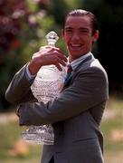 23 June 1997; Frank Dettori with the Budweiser Irish Derby Trophy as he hopes to partner Benny the Dip to victory at the upcoming race on the 29th of June at the Curragh racecourse in Kildare. Photo by Ray McManus/Sportsfile