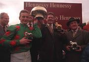 8 February 1998; Jockey Richard Dunwoody with owner Tom Doran and trainer Michael Hourigan, right, after they won the Hennessy Cognac Gold Cup with Dorans Pride during the horse racing from Leopardstown in Dublin. Photo by Matt Browne/Sportsfile