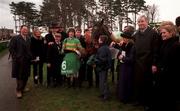 27 December 1998; Willing connections of Joe Mac including, from left, Eamonn Darcy, Dermot Desmond, Pat Hartigan, trainer Christy Roche, jockey Charlie Swan, JP McManus and former Limerick hurling player Joe McKenna pose for for a photo after winning the Paddy Power Future Champions Novice Hurdle during Day Two of the Leopardstown Christmas Festival 1998 at Leopardstown Racecourse in Dublin. Photo by Ray McManus/Sportsfile