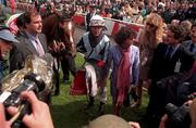 28 June 1998; Jockey Cash Asmussen returns to the parade ring with Dream Well and co owner Maria Niarchos, right, after winning the Budweiser Irish Derby during Horse Racing from The Curragh in Kildare. Photo by Damien Eagers/Sportsfile