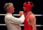 23 January 1998; Neil Gough is treated for a cut lip by Dr. Sean Donnelly during his welterweight bout against Francis Barrett at the Irish National boxing championships in the National Stadium, Dublin. Photo by Ray McManus/Sportsfile