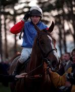 26 December 1998; Jockey Shay Barry celebrates on His Song as they enter the parade ring after winning the Denny Gold Medal Novice Steeplechase during the Leopardstown Christmas Festival Day One at Leopardstown Racecourse in Dublin. Photo by Ray McManus/Sportsfile