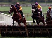 13 April 1998; Amberleigh House, with Graham Bradley up, right, jump the last next to Taklif, with Tom Rudd up, in the Jameson Gold Cup Novice Hurdle during the Fairyhouse Easter Festival - Irish Grand National day at Fairyhouse Racecourse in Ratoath, Meath. Photo by Matt Browne/Sportsfile