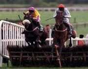 13 April 1998; Unarmed, with Tom Treacy up, right, clear the last next to Amberleigh House, with Graham Bradley up, on their way to winning the Jameson Gold Cup Novice Hurdle during the Fairyhouse Easter Festival - Irish Grand National day at Fairyhouse Racecourse in Ratoath, Meath. Photo by Matt Browne/Sportsfile