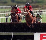 The Jameson Irish Grand National Stepplechase Handicap, Fairyhouse, 13/4/98. Bob Treacy and Tommy Treacy (Left) jump the last with Heist and Kieran Gaule (Right) Photograph Damien Eagers SPORTSFILE *** Local Caption *** 13 April 1998; x during the Fairyhouse Easter Festival - Irish Grand National day at Fairyhouse Racecourse in Ratoath, Meath. Photo by x/Sportsfile