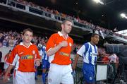 11 August 2004; Shelbourne captain Owen Heary, with the team mascot and Deportivo La Coruna captain Mauro Da Silva, right, lead their teams onto the pitch. UEFA Champions League, 3rd Round First Leg Qualifier, Shelbourne v Deportivo La Coruna, Lansdowne Road, Dublin. Picture credit; David Maher / SPORTSFILE