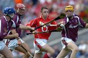 15 August 2004; Ger O'Leary, Cork, is tackled by Galway players, from left, Keith Kilkenny, John Lee and Martin Ryan. Minor Hurling Championship Semi-Final, Galway v Cork, Croke Park, Dublin. Picture credit; Ray McManus / SPORTSFILE