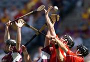 15 August 2004; Ger O'Driscoll, left, with team-mate Niall Horgan, Cork, in action against Kerril Wade, left, and Joe Canning, Wexford. Guinness Senior Hurling Championship Semi-Final, Wexford v Cork, Croke Park, Dublin. Picture credit; Brian Lawless / SPORTSFILE