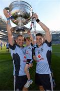22 September 2013; Dublin's Bernard Brogan with Alan Brogan and his son Jamie celebrate with the Sam Maguire cup following their side's victory. GAA Football All-Ireland Senior Championship Final, Dublin v Mayo, Croke Park, Dublin. Picture credit: Stephen McCarthy / SPORTSFILE