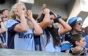 22 September 2013; Dublin supporters Niamh Fallon, left, and Ciara McCabe, from Portmarnock, react after their side miss a scoring chance during the first-half in the GAA Football All-Ireland Championship Finals, Croke Park, Dublin. Picture credit: Barry Cregg / SPORTSFILE