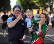 22 September 2013; Dublin supporter Niall Maher, from Leopardstown, Co. Dublin, and Mayo supporter Carine Maher, from Kiltimagh, Co. Mayo, and their one-year old daughter Olivia Maher ahead of the GAA Football All-Ireland Championship Finals, Croke Park, Dublin. Picture credit: Dáire Brennan / SPORTSFILE