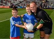 22 September 2013; Referee Conor Lane with the match ball mascots Michael Lavelle, from Achill Island, Co. Mayo, and Finn Murray, from Donaghmore, Co. Tyrone. Electric Ireland GAA Football All-Ireland Minor Championship Final, Tyrone v Mayo, Croke Park, Dublin. Photo by Sportsfile