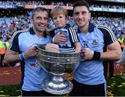 22 September 2013; Alan and Bernard Brogan celebrate with Alan's son Jamie and the Sam Maguire Cup after the game. GAA Football All-Ireland Senior Championship Final, Dublin v Mayo, Croke Park, Dublin. Picture credit: Ray McManus / SPORTSFILE