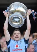 22 September 2013; Dublin's Paddy Andrews lifts the Sam Maguire Cup following their victory. GAA Football All-Ireland Senior Championship Final, Dublin v Mayo, Croke Park, Dublin. Picture credit: Stephen McCarthy / SPORTSFILE