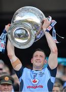 22 September 2013; Dublin's Denis Bastick lifts the Sam Maguire Cup following their victory. GAA Football All-Ireland Senior Championship Final, Dublin v Mayo, Croke Park, Dublin. Picture credit: Stephen McCarthy / SPORTSFILE