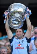 22 September 2013; Dublin's Bryan Cullen lifts the Sam Maguire Cup following their victory. GAA Football All-Ireland Senior Championship Final, Dublin v Mayo, Croke Park, Dublin. Picture credit: Stephen McCarthy / SPORTSFILE