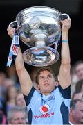 22 September 2013; Dublin's Michael Fitzsimons lifts the Sam Maguire cup following their victory. GAA Football All-Ireland Senior Championship Final, Dublin v Mayo, Croke Park, Dublin. Picture credit: Stephen McCarthy / SPORTSFILE