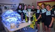 5 August 2024; Kerry players Anna Galvin, Aisling O'Connell, Eilís Lynch, Damien Carter, father of patient Billy, captain Niamh Carmody, Louise Ní Mhuircheartaigh and Cáit Lynch from TG4 All-Ireland Ladies Senior Football Champions are pictured with the Brendan Martin Cup during a visitm to Children's Health Ireland at Crumlin, Dublin.  Photo by Ray McManus/Sportsfile