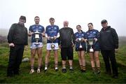 5 August 2024; Uachtarán Chumann Lúthchleas Gael Jarlath Burns, left, event sponsor Martin Donnelly, centre, and Camogie Association president Brian Molloy, right, pose with Winners, from second from left, Senior hurler Fionán Mackessy of Kerry, U16 hurler Matthew O'Sullivan of Kerry, U16 camogie player Ona Kennedy of Kilkenny and Senior camogie player Molly Lynch of Cork with their trophies after the 2024 M. Donnelly GAA All-Ireland Poc Fada Finals at Annaverna Mountain in the Cooley Peninsula, Ravensdale, Louth. Photo by Ben McShane/Sportsfile