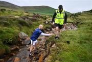 5 August 2024; Finbarr Kelly of Down retrieves his sliotar from the river during the 2024 M. Donnelly GAA All-Ireland Poc Fada Finals at Annaverna Mountain in the Cooley Peninsula, Ravensdale, Louth. Photo by Ben McShane/Sportsfile