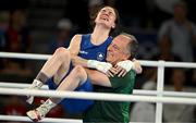 6 August 2024; Kellie Harrington of Team Ireland celebrates with head coach Zaur Antia after defeating Wenlu Yang of Team People's Republic of China in their women's 60kg final bout at Court Philippe-Chatrier in Roland Garros Stadium during the 2024 Paris Summer Olympic Games in Paris, France. Photo by Brendan Moran/Sportsfile