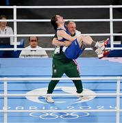 6 August 2024; Kellie Harrington of Team Ireland celebrates with head coach Zaur Antia after defeating Wenlu Yang of Team People's Republic of China in their women's 60kg final bout at Court Philippe-Chatrier in Roland Garros Stadium during the 2024 Paris Summer Olympic Games in Paris, France. Photo by Stephen McCarthy/Sportsfile