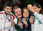 6 August 2024; The women's 60kg podium, from left to right, Silver medalist Wenlu Yang of Team People's Republic of China, Gold medalist Kellie Harrington of Team Ireland, Bronze medalists Beatriz Soares Ferreira of Team Brazil, and Shih Yi Wu of Team Chinese Taipei take a photo at Court Philippe-Chatrier in Roland Garros Stadium during the 2024 Paris Summer Olympic Games in Paris, France. Photo by Stephen McCarthy/Sportsfile