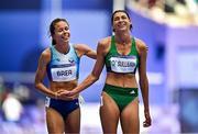 7 August 2024; Sophie O’Sullivan of Team Ireland, right, with Daniely Joselyn Brea of Team Venezuela, after finishing fourth in her women's 1500m repechage at the Stade de France during the 2024 Paris Summer Olympic Games in Paris, France. Photo by Sam Barnes/Sportsfile