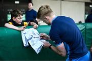 6 August 2024; Tommy O'Brien signs autographs during a Leinster Rugby open training session at Lansdowne FC in Dublin. Photo by Harry Murphy/Sportsfile