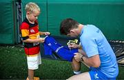 6 August 2024; Cormac Foley signs autographs during a Leinster Rugby open training session at Lansdowne FC in Dublin. Photo by Harry Murphy/Sportsfile
