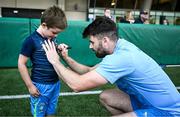 6 August 2024; Harry Byrne signs an autograph during a Leinster Rugby open training session at Lansdowne FC in Dublin. Photo by Harry Murphy/Sportsfile