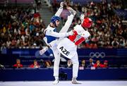 7 August 2024; Jack Woolley of Team Ireland, left, in action against Gashim Magomedov of Team Azerbaijan during the men's -58kg round of 16 at the Grand Palais during the 2024 Paris Summer Olympic Games in Paris, France. Photo by Stephen McCarthy/Sportsfile
